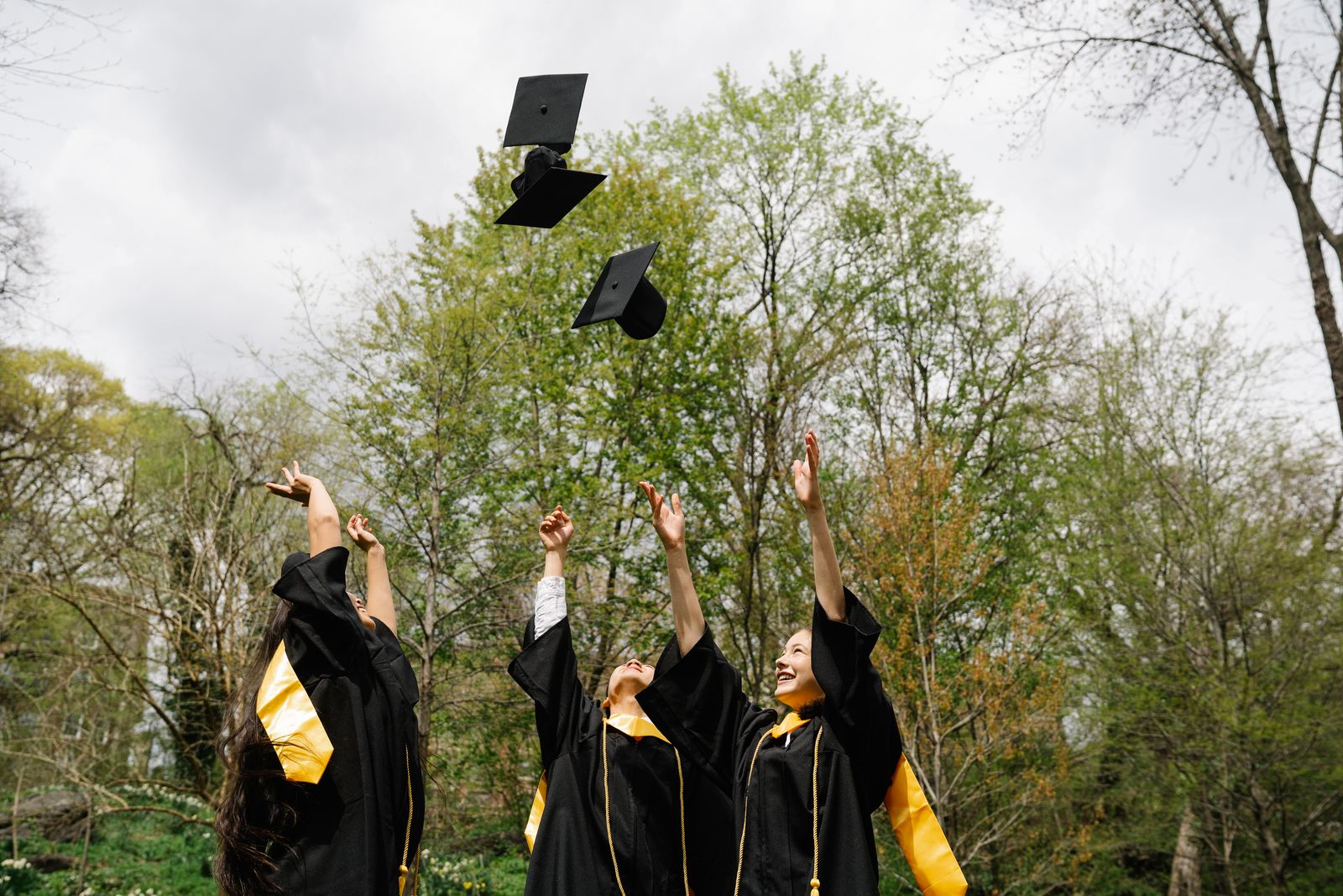 Graduates under a sky full of balloons